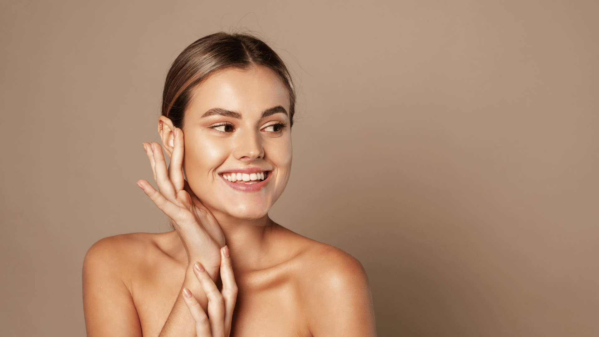 Client with glowing skin and a soft smile